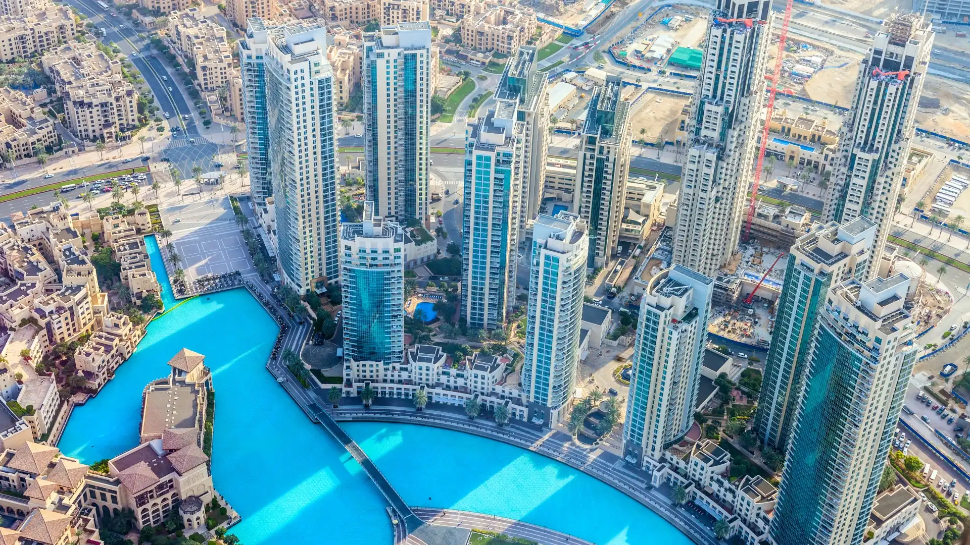 Aerial view of serviced apartment towers in Downtown Dubai near the Burj Khalifa and Dubai Fountain.