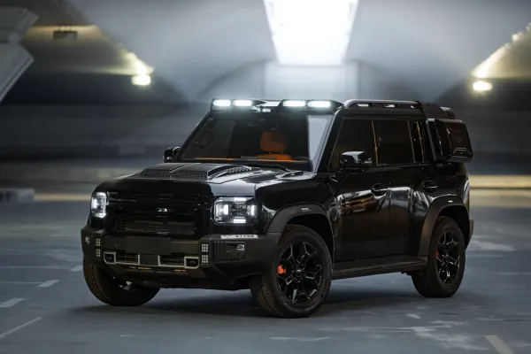 Black Jetour T2 SUV parked in Dubai garage, available for luxury rental at Solid Cars, 254 hp, AED 550 daily.