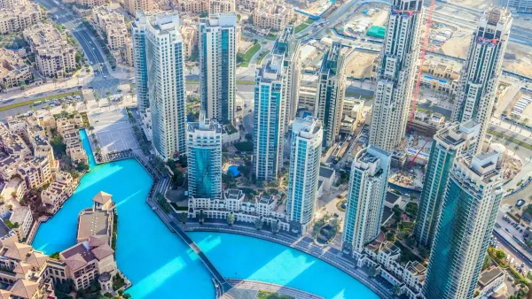 Aerial view of serviced apartment towers in Downtown Dubai near the Burj Khalifa and Dubai Fountain.